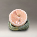 Alabaster sculpture of a pink grapefruit
